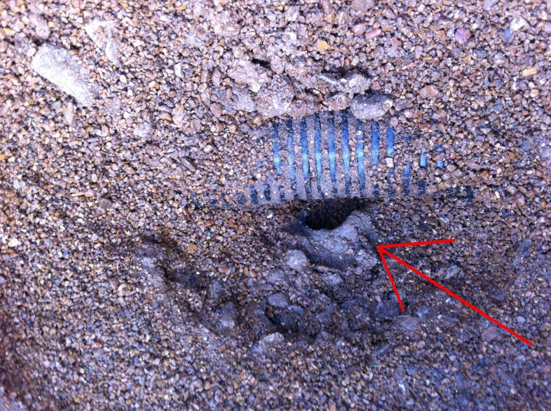 Red Arrow Pointing to Clay Drain Line